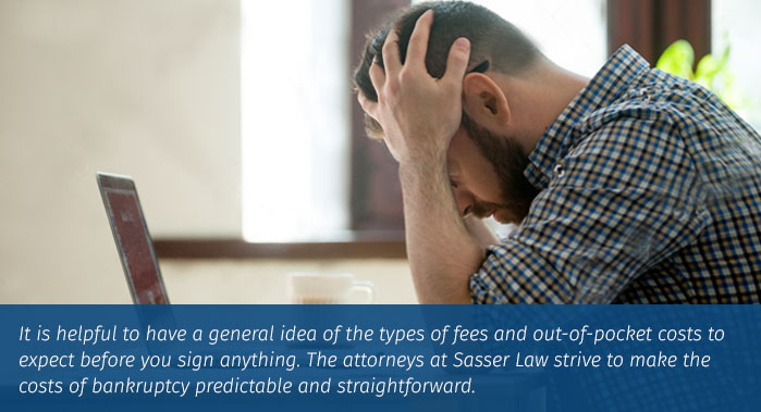 concerned male considering bankruptcy with computer open