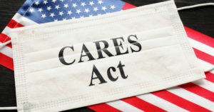 United States flag and face mask with Cares Act text on it